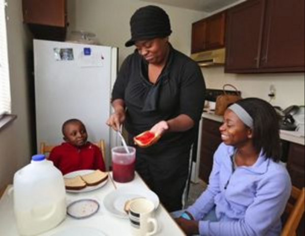 Luatonya and her children now live in a safe home thanks to a program funded by document recording fees. Photo from Seattle Times.